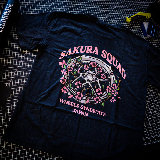 Blitz Sakura Tee back graphic featuring a classic JDM wheel and cherry blossoms