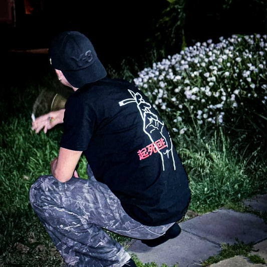 Club OG Tee worn outdoors showing Clubhouse Syndicate back artwork